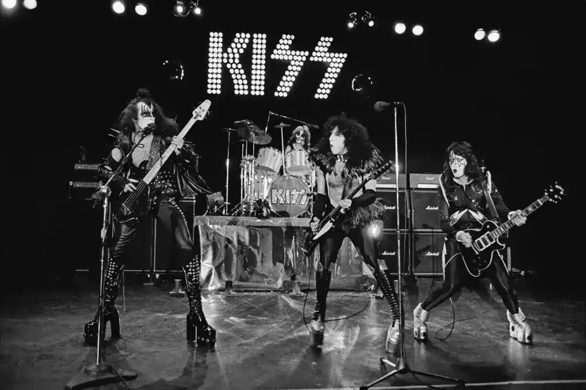 American rock group Kiss perform live on stage at Cobo Hall in Detroit during the concert recording of Alive! on 16th May 1975. Left to right: Gene Simmons, Peter Criss, Paul Stanley and Ace Frehley.