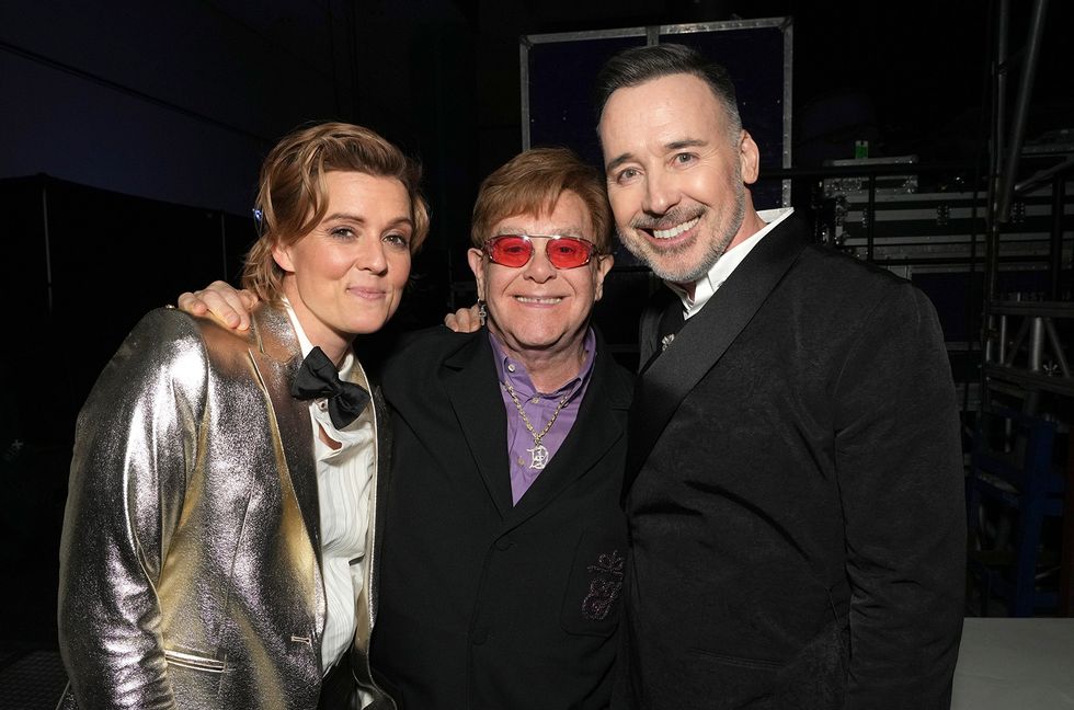 Brandi Carlile, Elton John, and David Furnish attend MusiCares Persons of the Year Honoring Berry Gordy and Smokey Robinson at Los Angeles Convention Center on Feb. 3, 2023 in Los Angeles, California.