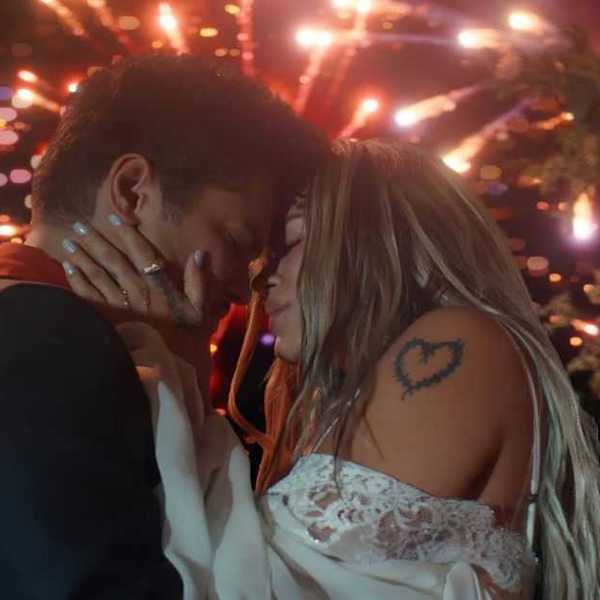 Bruno Mars and Karol G in "Dance With Me" Music Video