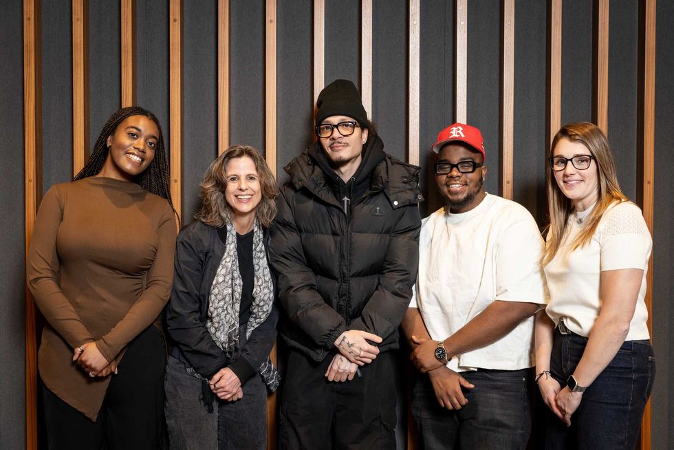 Casper TNG (center) with (LR): Imani Busby, A&R Scout, UMC; Julie Adam, President & CEO, Universal Music Canada; Kwaku Agyemang, A&R Manager, UMC; Amanda Kingsland, Vice President, A&R, UMC.