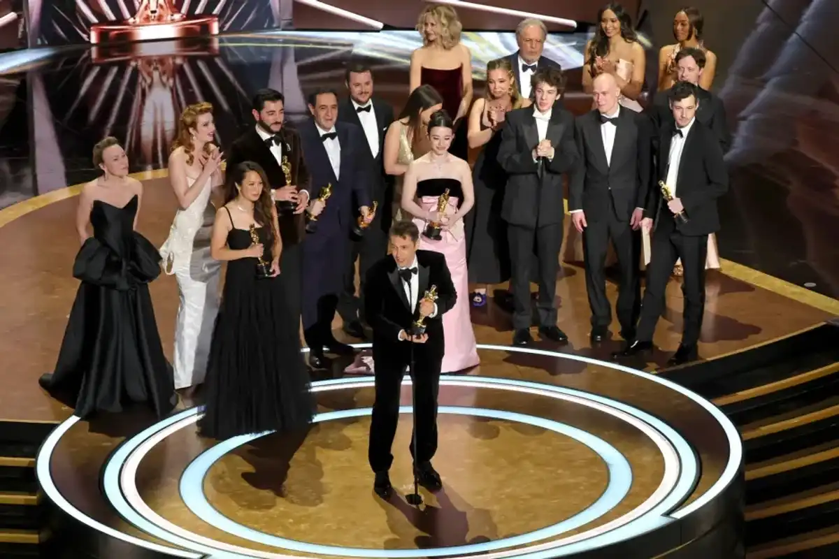 Cast and crew including Darya Ekamasova, Lindsey Normington, Vache Tovmasyan, Karren Karagulian, Alex Coco, Mikey Madison, Mark Eydelshteyn, Samantha Quan, Luna Sofía Miranda, Sean Baker, Drew Daniels and Yura Borisov accept the Best Picture award for "Anora" onstage during the 97th Annual Oscars at Dolby Theatre on March 02, 2025 in Hollywood, Calif.