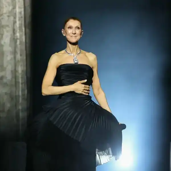 Celine Dion reacts as she performs during her first concert of a series at the Plenitude Arena in Nanterre, west of Paris on Sept. 12, 2026.
