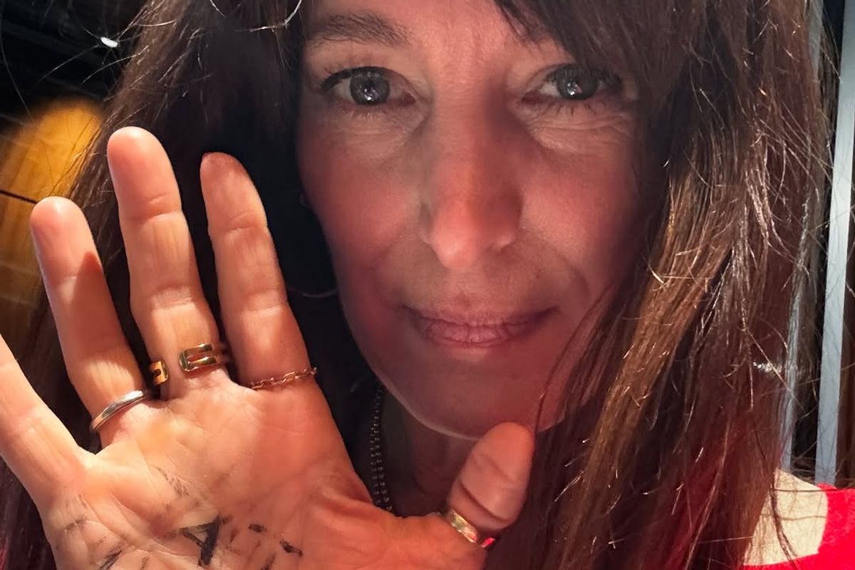 Chantal Kreviazuk with the new lyrics written on her hand.