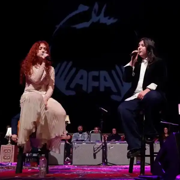 Chappell Roan and Lucy Dacus perform during Artists for Aid at Shrine Auditorium and Expo Hall on January 10, 2026 in Los Angeles.