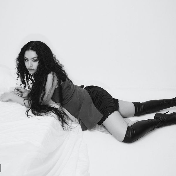 Charli xcx photographed July 4, 2024 at Loft Studios in London. Balenciaga top, skirt and boots.