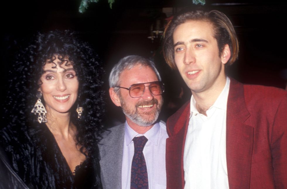 Cher, Norman Jewison and Nicolas Cage at the 'Moonstruck' premiere in 1987.