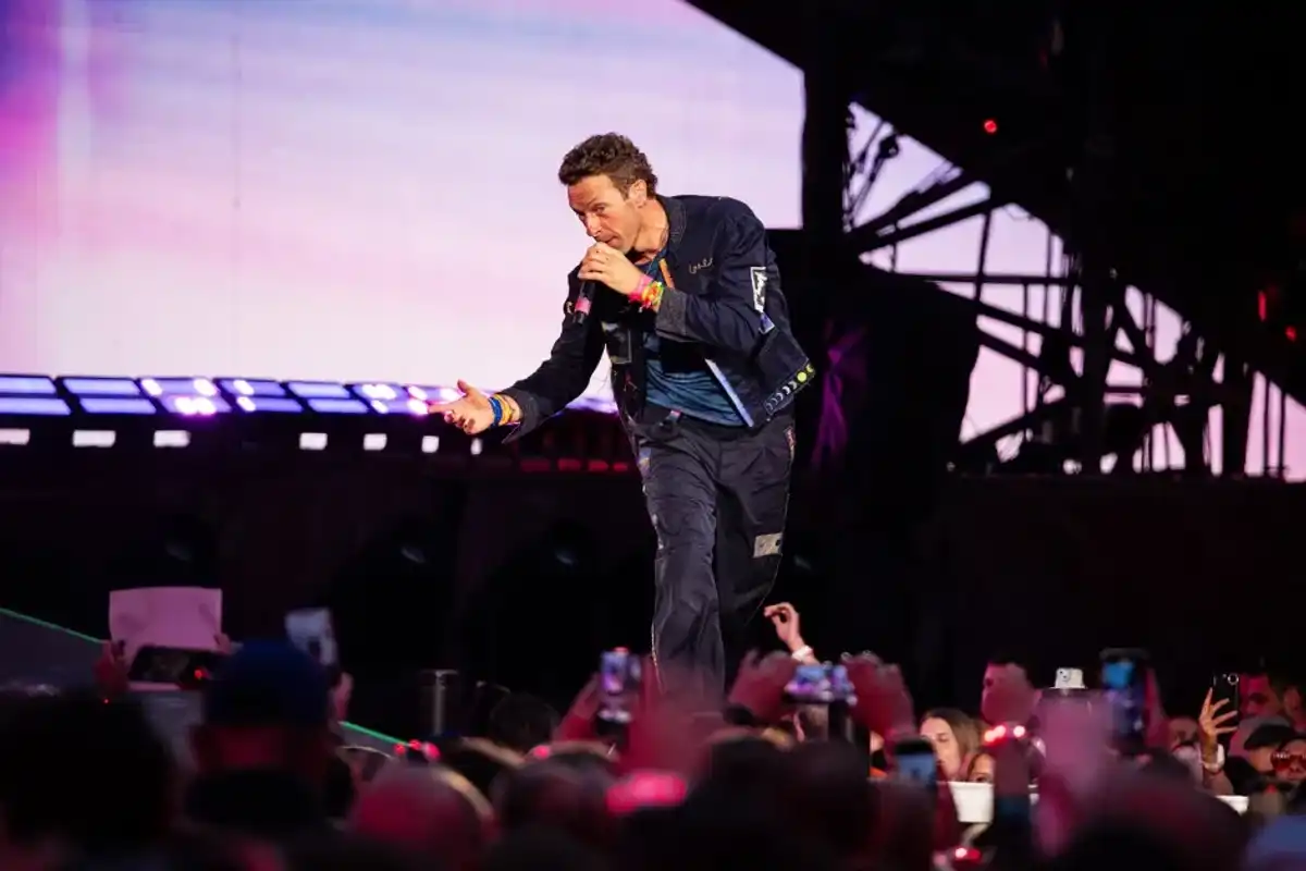 Chris Martin of Coldplay performs live on stage during their "Music of the Spheres" World Tour at Craven Park Stadium on August 18, 2025 in Hull, England.