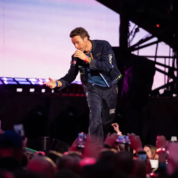Chris Martin of Coldplay performs live on stage during their "Music of the Spheres" World Tour at Craven Park Stadium on August 18, 2025 in Hull, England.