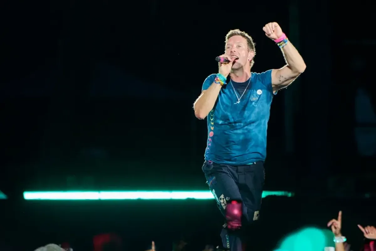 Coldplay’s Chris Martin Bounces Back From Astronomer Kiss-Cam Scandal With Sweet Serenade of Soccer Legend Lionel Messi & Wife