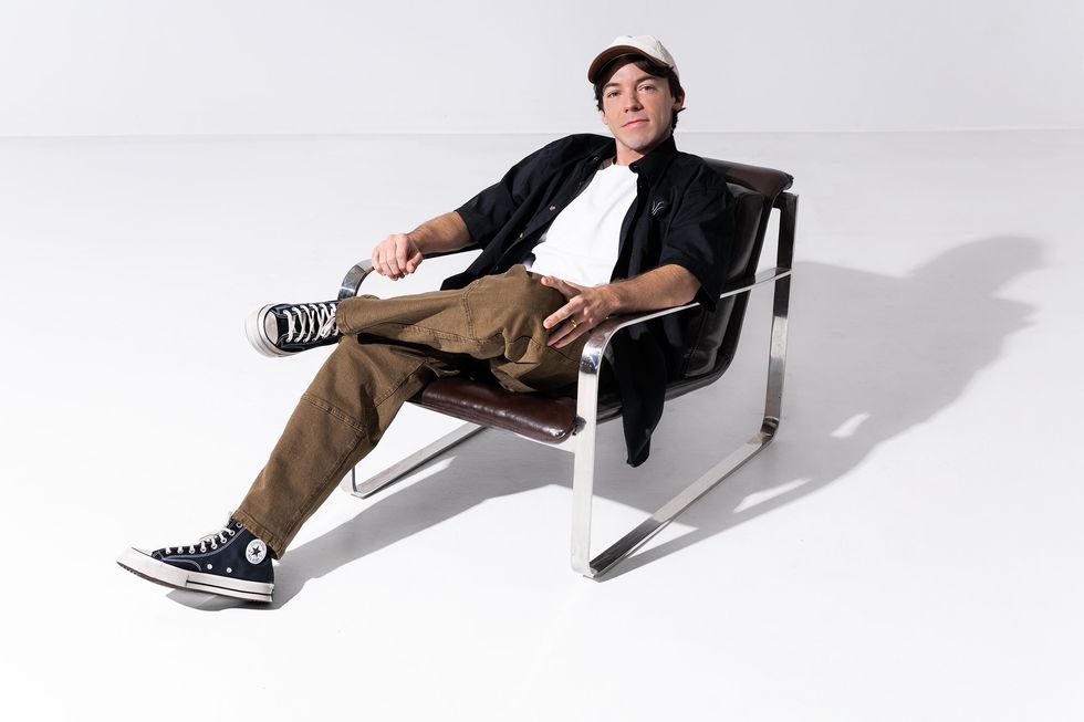 Connor Price photographed by Lane Dorsey on Apr. 2, 2025 in Toronto. Styling by Lilli Wickham and style coordinating by Liam Colbourne. Purple Hearts Supply pants and Converse shoes.