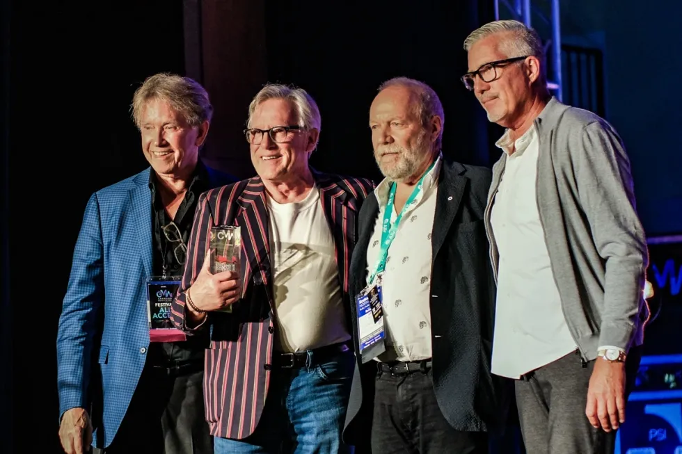 David Farrell accepting his Lifetime Achievement Award at Canadian Music Week 2024. From left: Neill Dixon, David Farrell, Gary Slaight, Derrick Ross