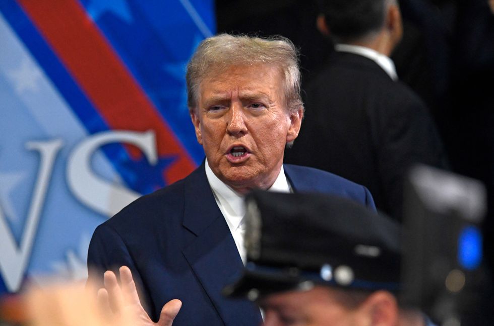 Donald Trump speaks to members of the press in the spin room following a presidential debate with US Vice President and Democratic presidential candidate Kamala Harris at the National Constitution Center in Philadelphia, Pennsylvania, on Sept. 10, 2024.