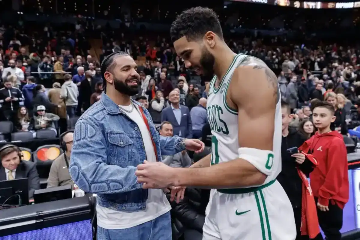 Drake greets Jayson Tatum #0 of the Boston Celtics after their NBA In-Season Tournament game against the Toronto Raptors at Scotiabank Arena on November 17, 2023 in Toronto, Canada.