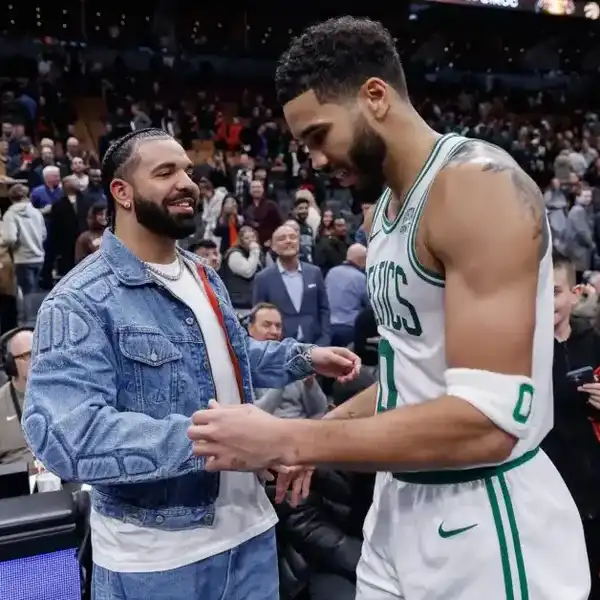 Drake greets Jayson Tatum #0 of the Boston Celtics after their NBA In-Season Tournament game against the Toronto Raptors at Scotiabank Arena on November 17, 2023 in Toronto, Canada.
