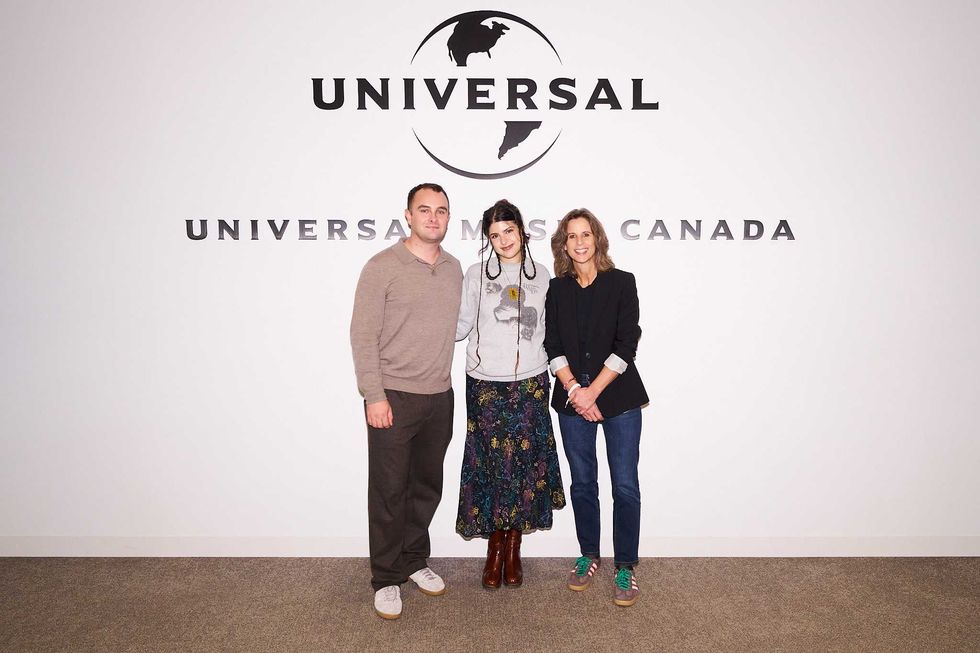 Ebril (middle) with Universal Music Canada's Mark O'Keeffe and Julie Adam.