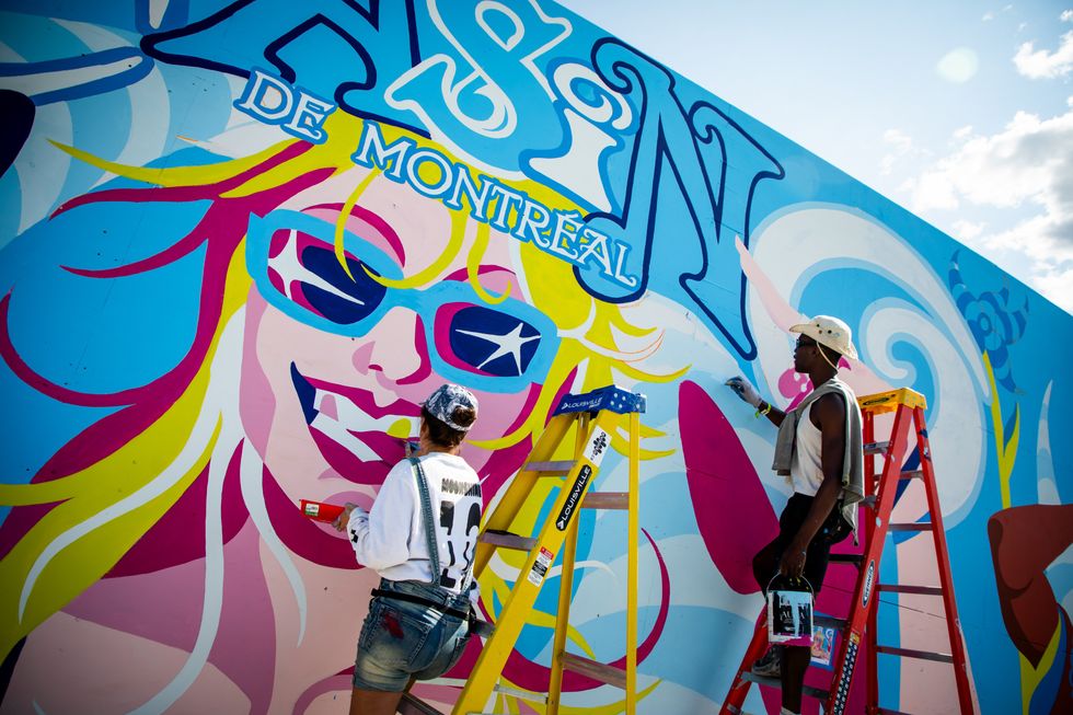 Franco \u00c9galit\u00e9 working on the Osheaga 2025 mural.