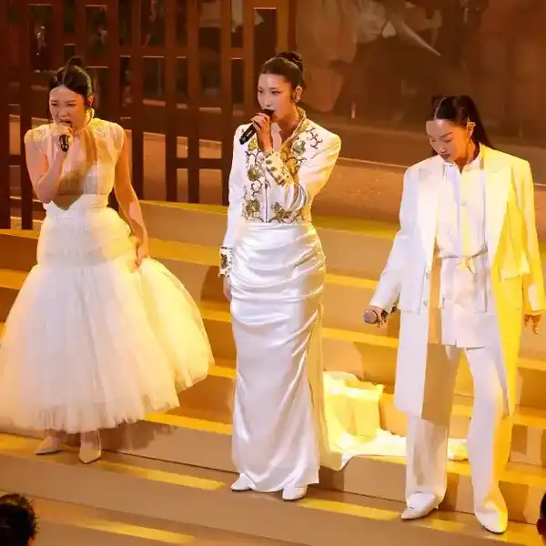 From left: REI AMI, EJAE, and AUDREY NUNA perform during the 98th Oscars at Dolby Theatre on March 15, 2026, in Hollywood.