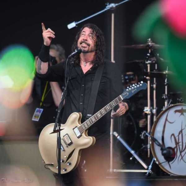 GLASTONBURY, ENGLAND - JUNE 23: Dave Grohl of the Foo Fighters gestures to the sky after referring to the late drummer Taylor Hawkins as the band perform on the Pyramid Stage on Day 3 of Glastonbury Festival 2023 on June 23, 2023 in Glastonbury, England. The Glastonbury Festival of Performing Arts sees musicians, performers and artists come together for three days of live entertainment.