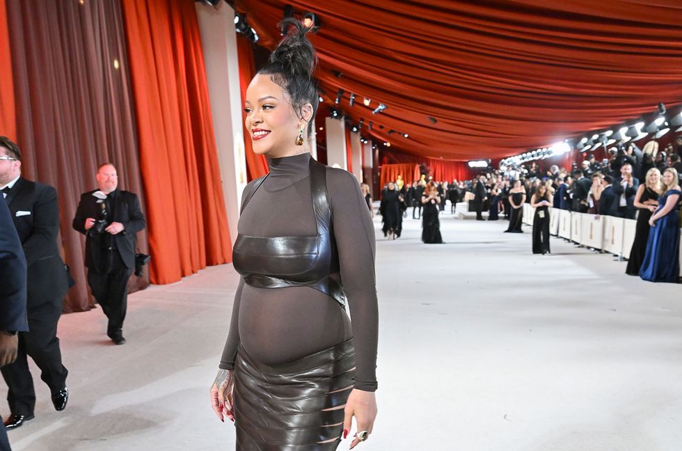 Rihanna Shows Off Her Baby Bump in Louis Vuitton Menswear Photos