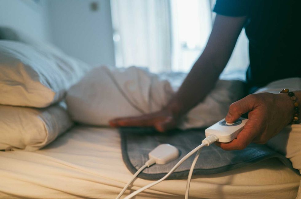 Thousands of People Are Using a $30 Weighted Heating Pad to Help Relieve Aches & Cramps
