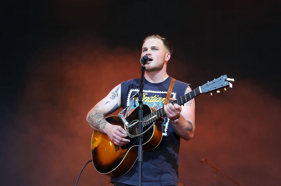 Zach Bryan Says He & Travis Tritt Met ‘Eye to Eye’ to Settle Online Feud