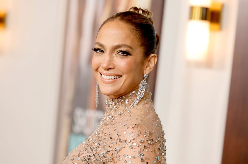 Jennifer Lopez Enjoys the Fourth of July Lounging in Pink Swimsuit