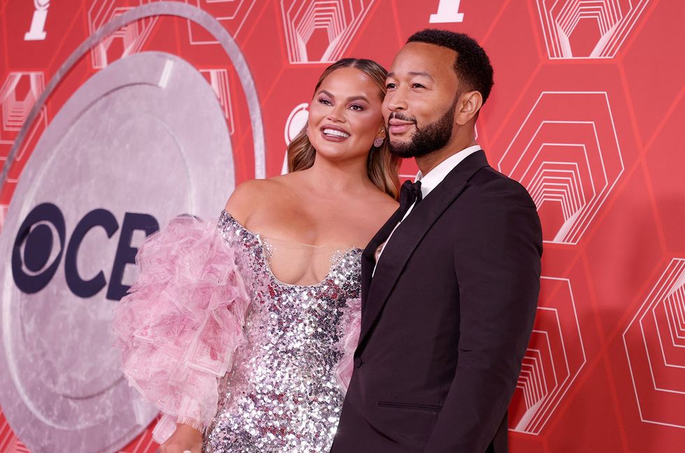 Chrissy Teigen Crashes John Legend’s Interview & Shows Off Baby Bump: Watch