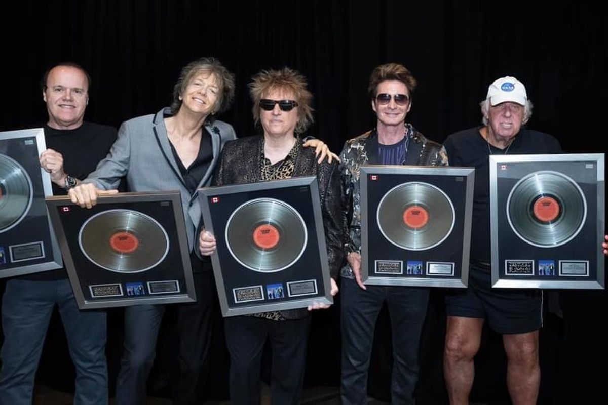 Jeff Burns (right) with the members of Platinum Blonde holding plaques from Music Canada commemorating the multi-platinum success of the album 'Alien Shores.'