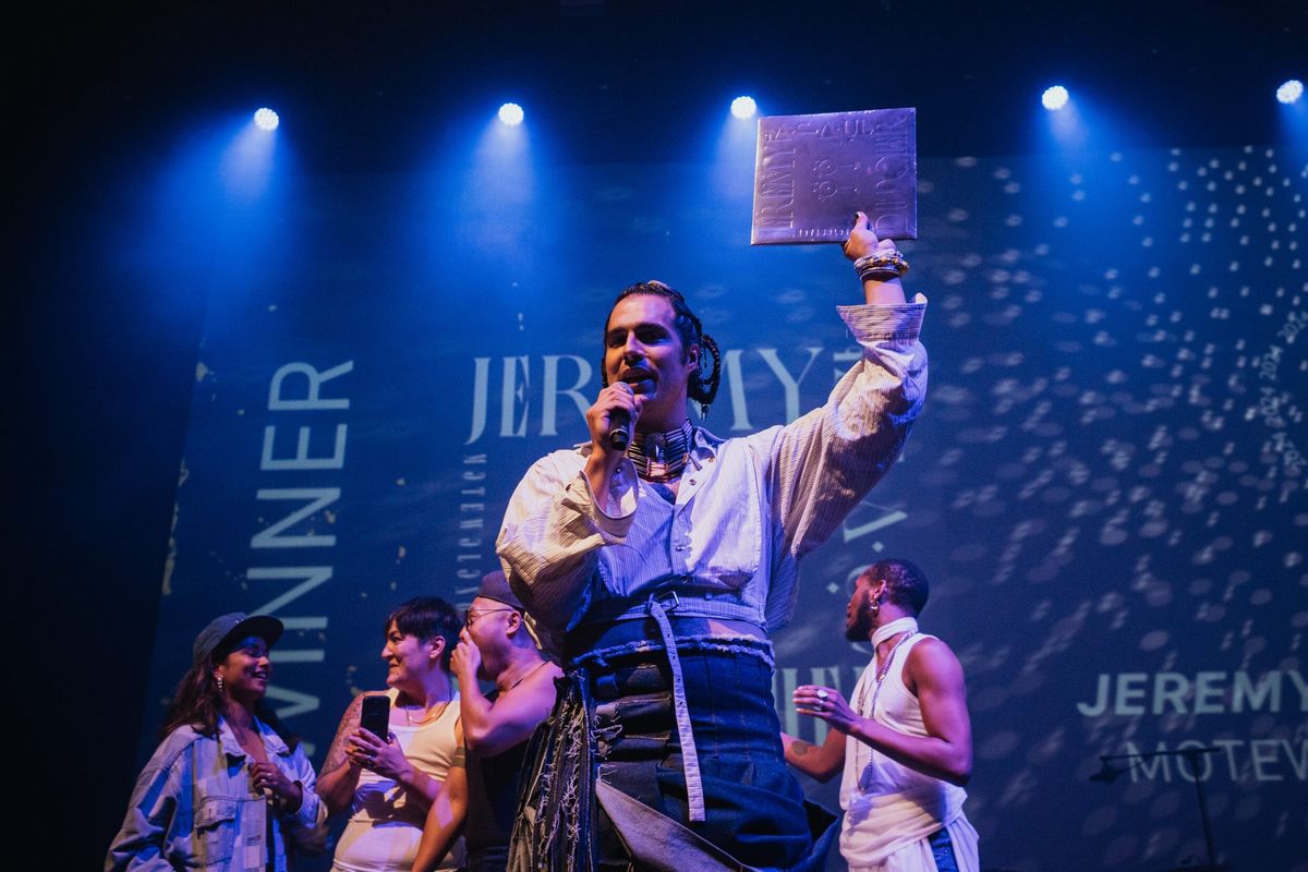 Jeremy Dutcher accepts the 2024 Polaris Prize on Sept. 17 at Massey Hall in Toronto.