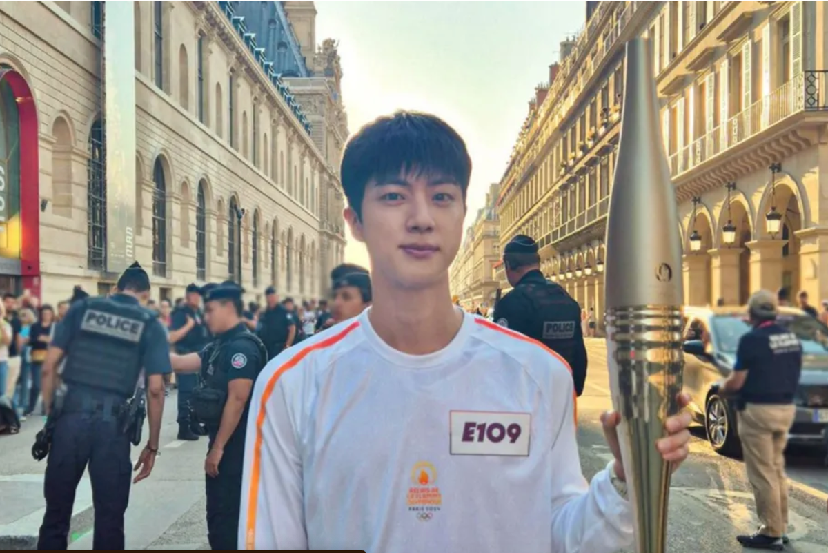 Jin of BTS participates in the Paris 2024 Olympic Torch Relay on July 14, 2024.