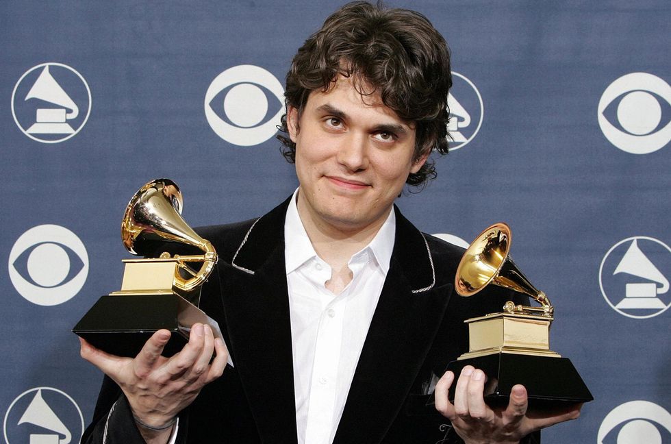 John Mayer poses with two trophies he won for Best Male Pop Vocal Performance and Song of the Year at the 47th Annual Grammy Awards in Los Angeles on Feb. 13, 2005.