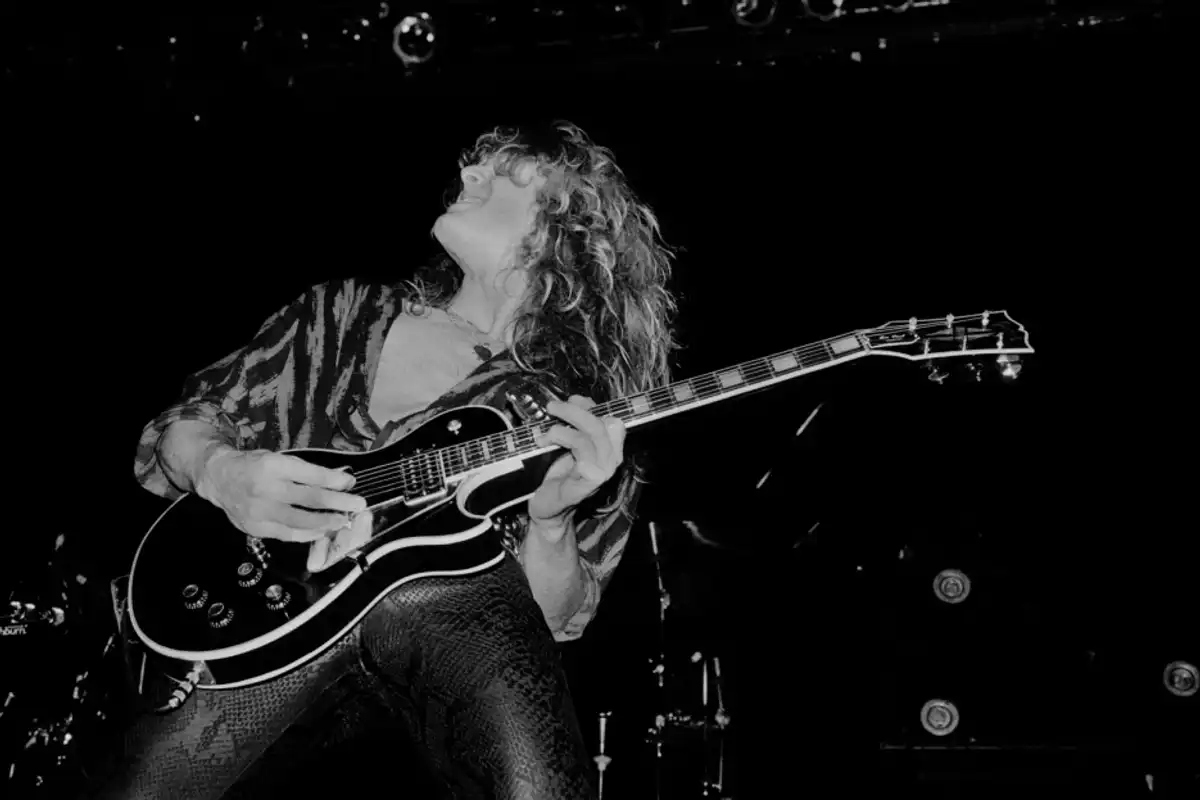 John Sykes performs onstage with Whitesnake at the UIC Pavilion in Chicago on Nov. 10, 1984.