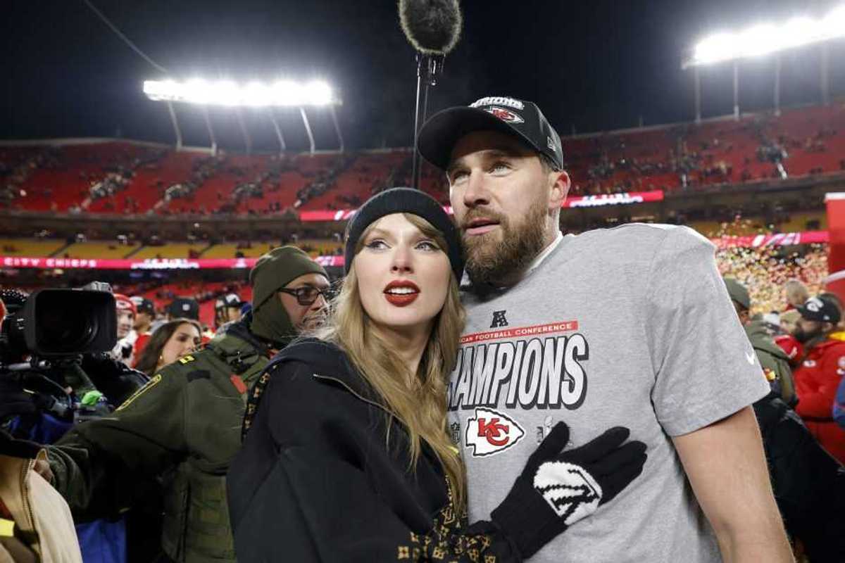 KANSAS CITY, MISSOURI - JANUARY 26: Taylor Swift celebrates with Travis Kelce #87 of the Kansas City Chiefs after defeating the Buffalo Bills 32-29 in the AFC Championship Game at GEHA Field at Arrowhead Stadium on Jan. 26, 2025, in Kansas City.