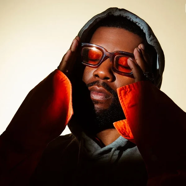 Khalid photographed by Joelle Grace Taylor on April 28, 2025 at Hype Studios in Los Angeles. Styling by Aaron Cristmon and Marquise Miller. Grooming by Jenn Hanching. Manicure by Jessica Dresser. Tailoring by Karina Cardona. Blue Marble hoodie and shirt, Yordy rings, Bonnie & Clyde glasses.