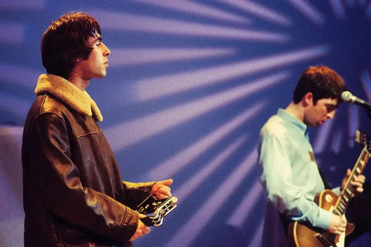 Liam Gallagher and Noel Gallagher of Oasis performing on UK TV show in 1995.