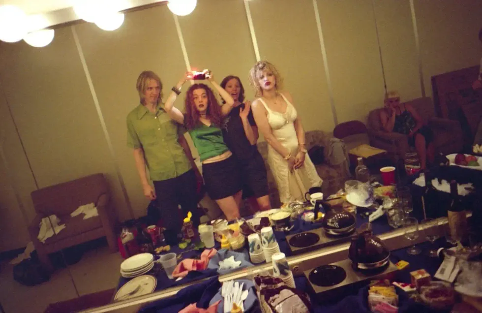 Melissa Auf der Maur, Self-portrait in mirror with Hole, Lollapalooza backstage, USA, 1995, chromogenic print \u00a9