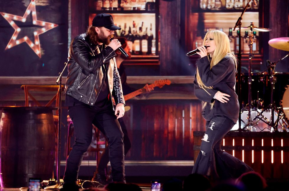 Nate Smith and Avril Lavigne perform onstage during the 59th Academy of Country Music Awards at The Ford Center at The Star on May 16, 2024 in Frisco, Texas.