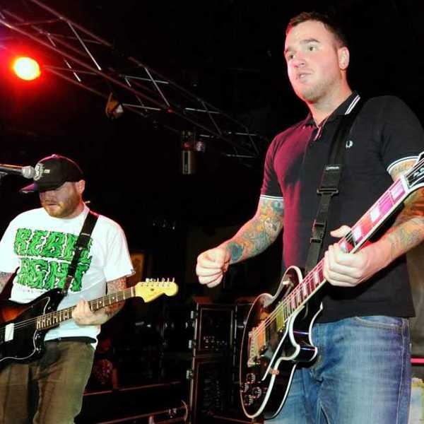 New Found Glory guitarists Steve Klein (L) and Chad Gilbert perform during the Pop Punk's Not Dead tour at the Hard Rock Cafe on the Strip in support of the band's new album, "Radiosurgery" on November 19, 2011 in Las Vegas, Nevada.