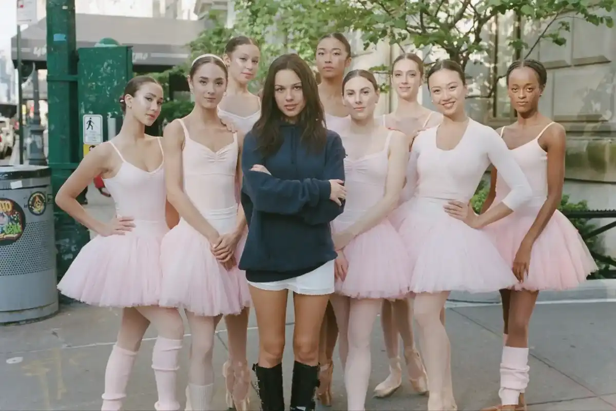Olivia Rodrigo with the dancers, including Tiler Peck (immediate right) in her "stupid song" video.