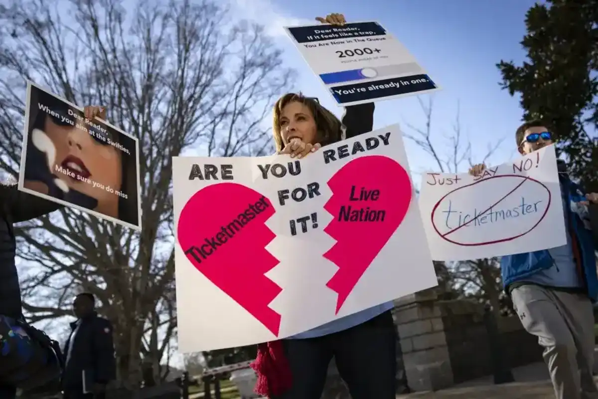 Penny Harrison and her son Parker Harrison rally against the live entertainment ticket industry outside the U.S. Capitol January 24, 2023 in Washington, DC.