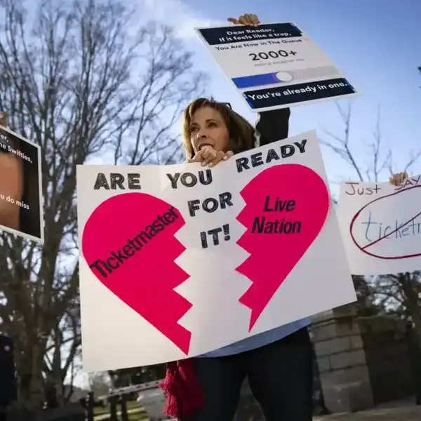 Penny Harrison and her son Parker Harrison rally against the live entertainment ticket industry outside the U.S. Capitol January 24, 2023 in Washington, DC.