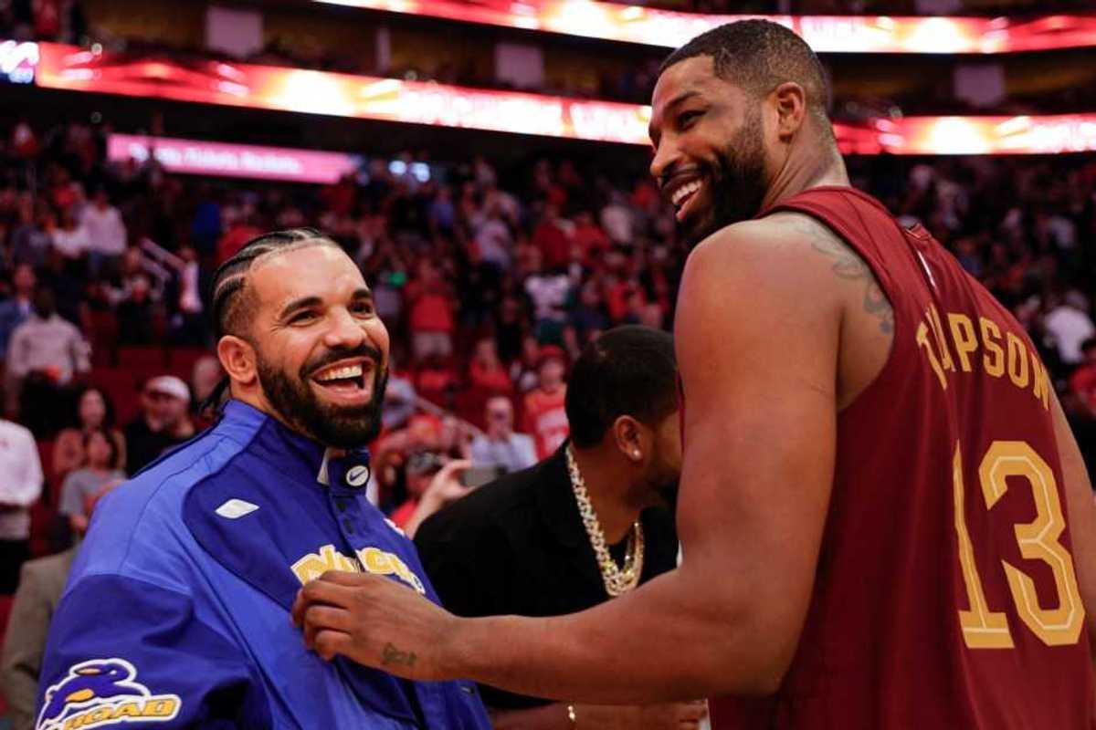 Rapper, songwriter, and icon Drake speaks with Tristan Thompson #13 of the Cleveland Cavaliers following a game against the Houston Rockets at Toyota Center on March 16, 2024 in Houston, Texas.