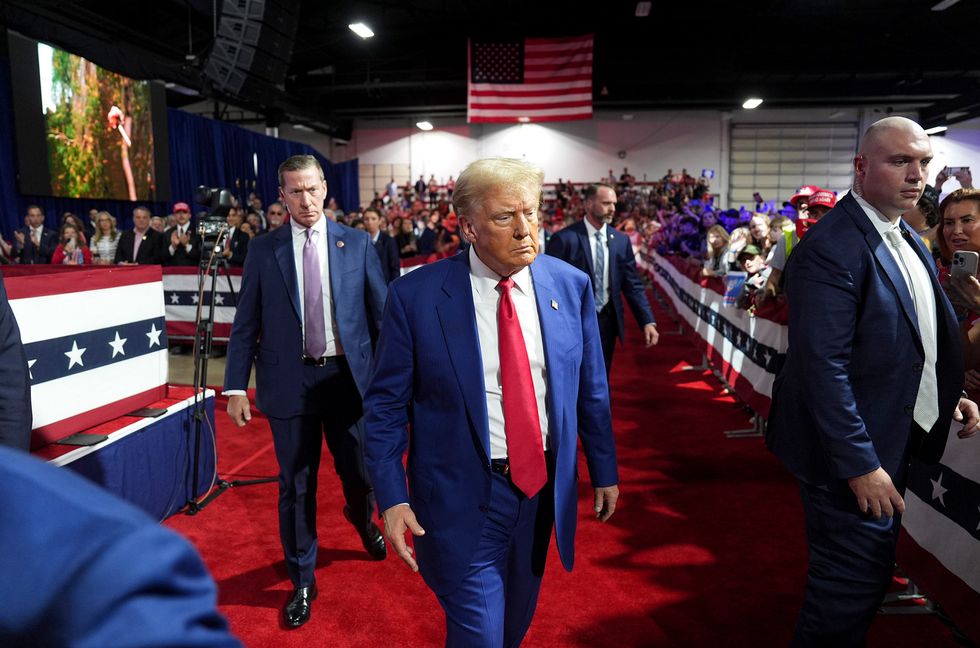 Republican presidential nominee former President Donald Trump walks to greet supporters during a town hall event held at the Greater Philadelphia Center and Fairgrounds, in Oaks, PA on Oct. 14, 2024.