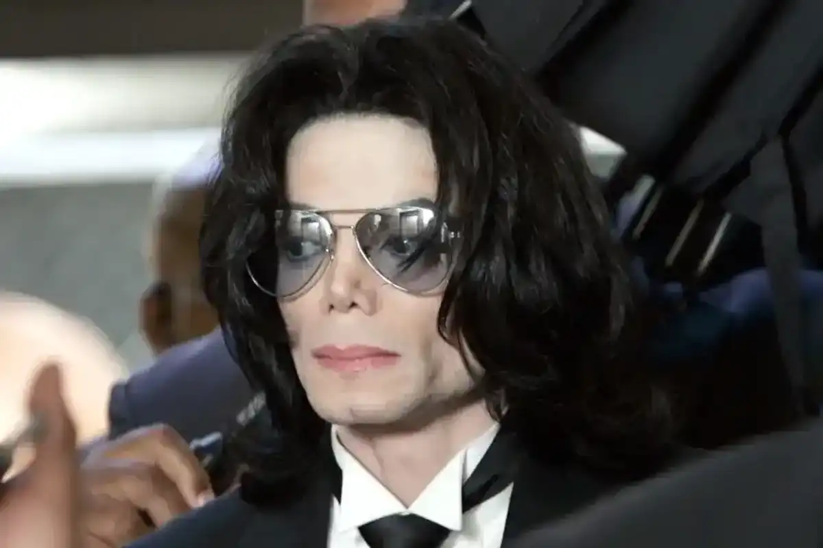 SANTA MARIA, CA - JUNE 13: Michael Jackson prepares to enter the Santa Barbara County Superior Court to hear the verdict read in his child molestation case June 13, 2005 in Santa Maria, California. After seven days of deliberation the jury has reached a not guilty verdict on all 10 counts in the trial against Michael Jackson. Jackson was charged in a 10-count indictment with molesting a boy, plying him with liquor and conspiring to commit child abduction, false imprisonment and extortion. He pleaded innocent.
