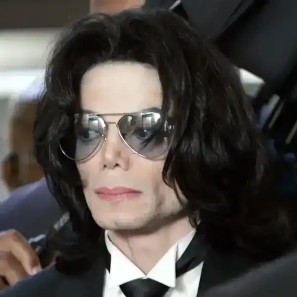 SANTA MARIA, CA - JUNE 13: Michael Jackson prepares to enter the Santa Barbara County Superior Court to hear the verdict read in his child molestation case June 13, 2005 in Santa Maria, California. After seven days of deliberation the jury has reached a not guilty verdict on all 10 counts in the trial against Michael Jackson. Jackson was charged in a 10-count indictment with molesting a boy, plying him with liquor and conspiring to commit child abduction, false imprisonment and extortion. He pleaded innocent.