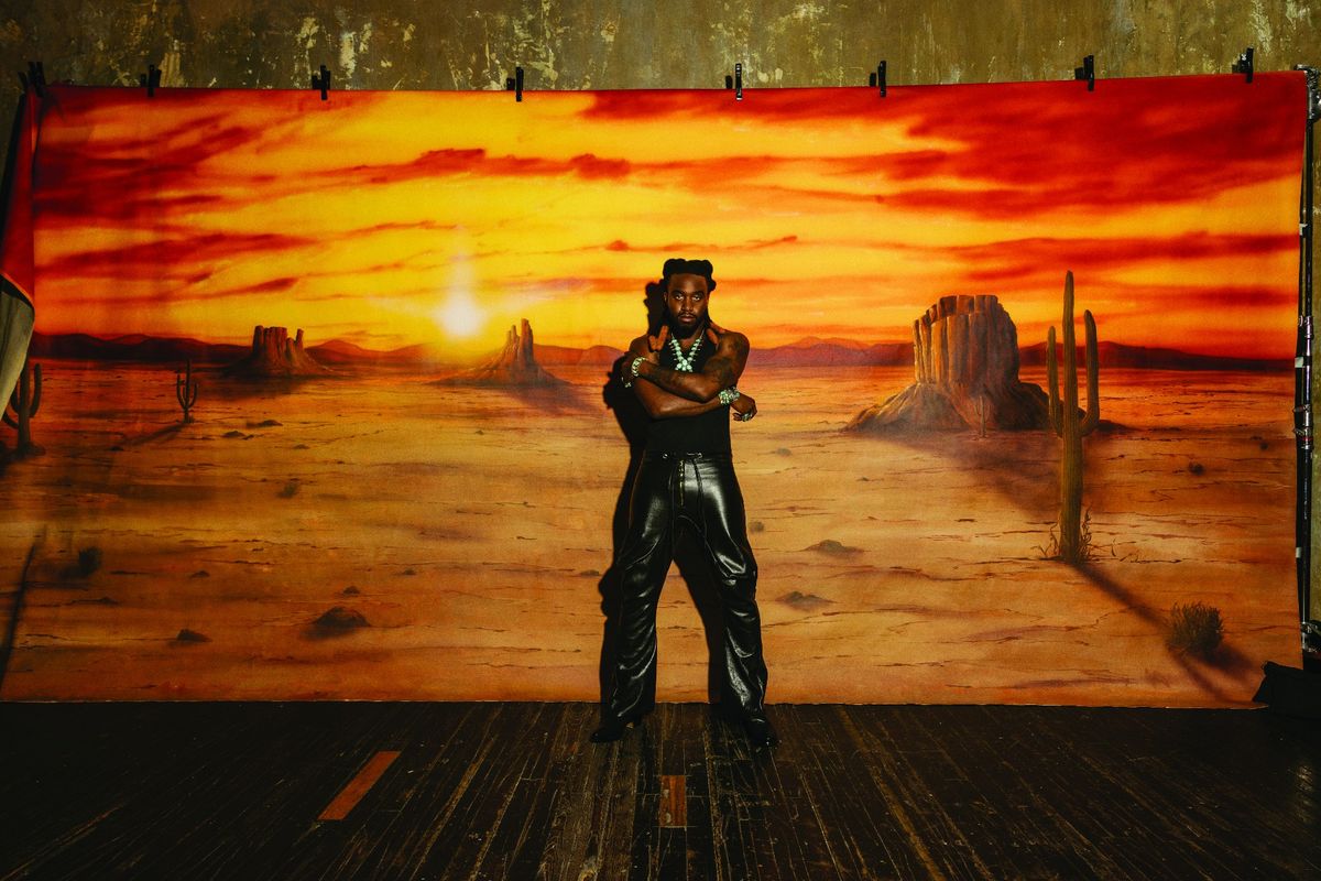 Shaboozey photographed by Eric Ryan Anderson on September 12, 2024 at Seret Studios in Brooklyn. Styling by Anastasia Walker. Grooming by Laura Costa using Milk Makeup at Exclusive Artists. Hanes tank, New Bedstuy pants, 424 shoes, Bo Joe, David Yurman and Calli Co. Silver jewelry.
