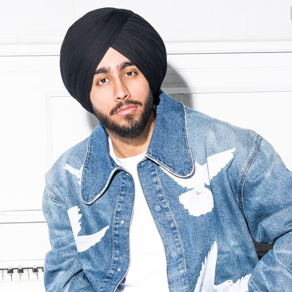 Shubh photographed by Lane Dorsey in Toronto in 2025. Styling by Aliecia Brissett. Jacket: 3PARADIS from Simons. Jeans: Le 31 from Simons.