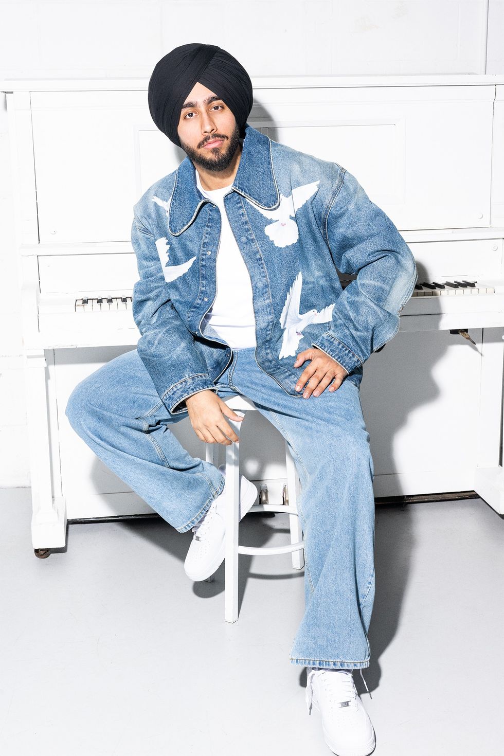 Shubh photographed by Lane Dorsey in Toronto in 2025. Styling by Aliecia Brissett. Jacket: 3PARADIS from Simons. Jeans: Le 31 from Simons.