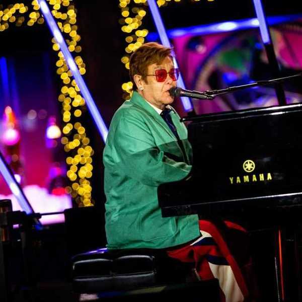Sir Elton John performs in the opening ceremony for Saks Fifth Avenue’s Holiday Windows and Light show on November 22, 2022 in New York City.