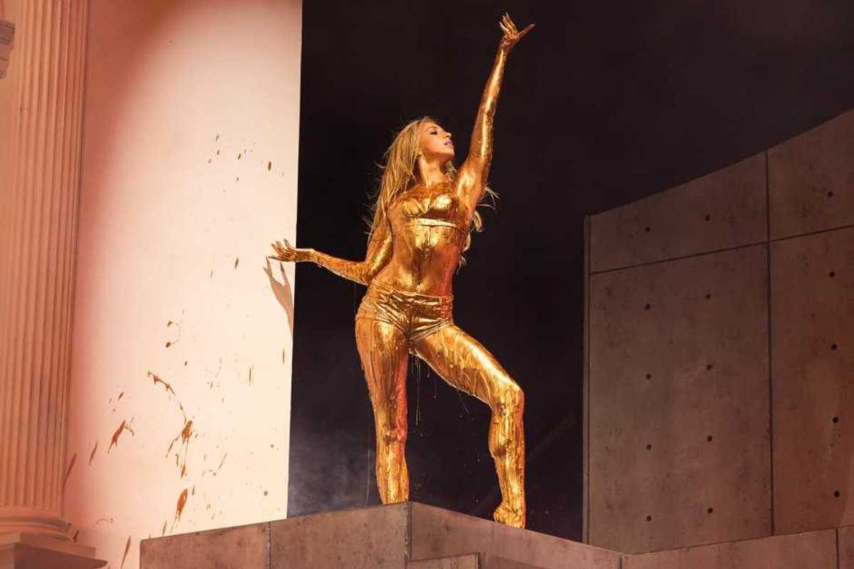 Tate McRae closes out her set covered in gold paint performing “Sports Car” during her headlining set at Lollapalooza in Grant Park on Aug. 2, 2026, in Chicago.